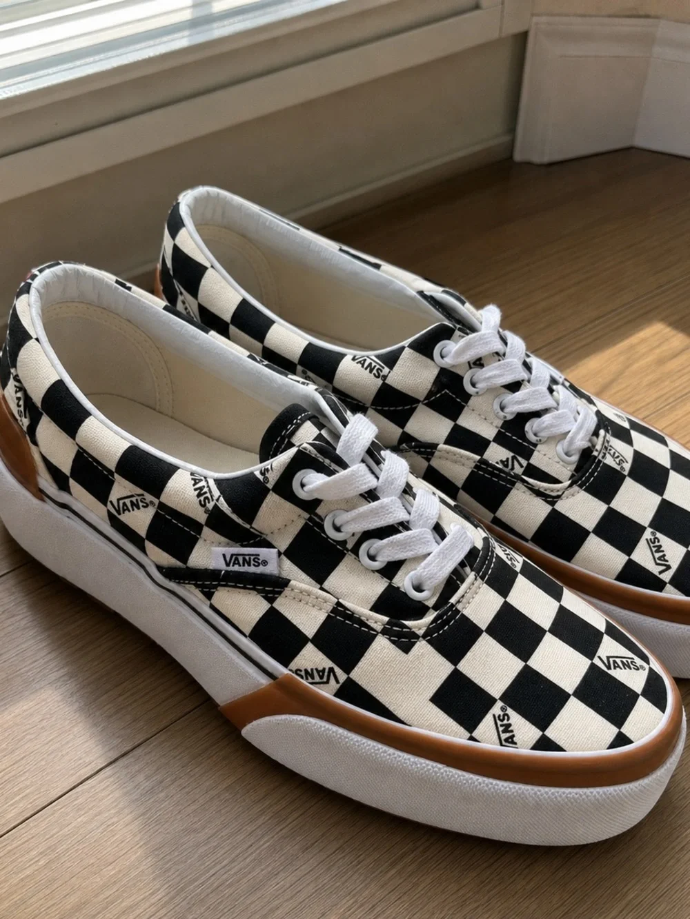 Vans Checkerboard Slip-On Sneakers in Black and White